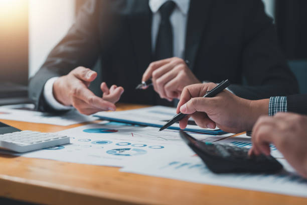 Business People Doing Calculations - For Business Consultant Service