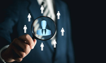 Businessman Using Magnifying Glass - For Talent Search