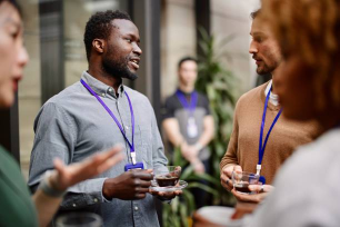 Entrepreneurs Dringking Black Coffee While Standing - For Creative Event Strategist